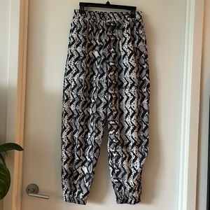 Women’s black and white Adidas Windbreaker Pants Medium